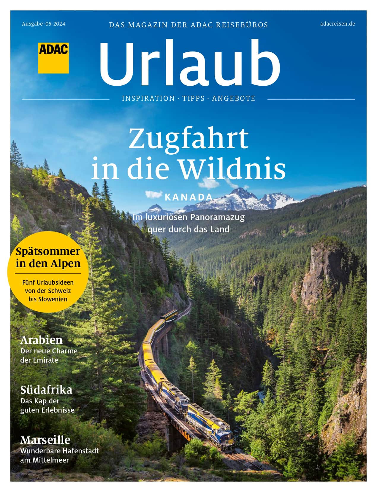 ADAC Magazin-Cover zeigt Zug in malerischer Berglandschaft, bunte Herbstfarben, leuchtend blauer Himmel.