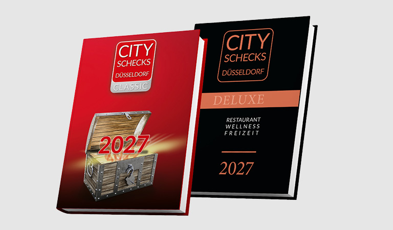 Zwei Bücher mit roten und schwarzen Covern zeigen den Schriftzug City Schecks 2027