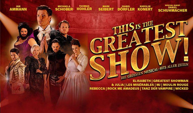 Eine Gruppe von Menschen posiert vor einem roten Hintergrund, Schriftzug: "THE GREATEST SHOW."