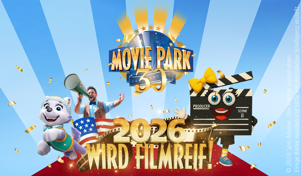 Ein fröhlicher Mann mit Megafon, ein weißes Maskottchen und eine Filmklappe feiern