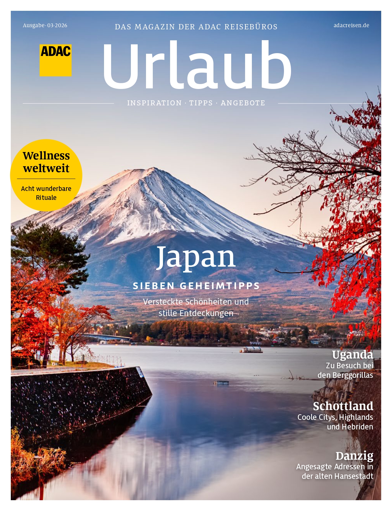 Ein ruhiger See spiegelt den schneebedeckten Fuji mit bunten Herbstbäumen im Vordergrund